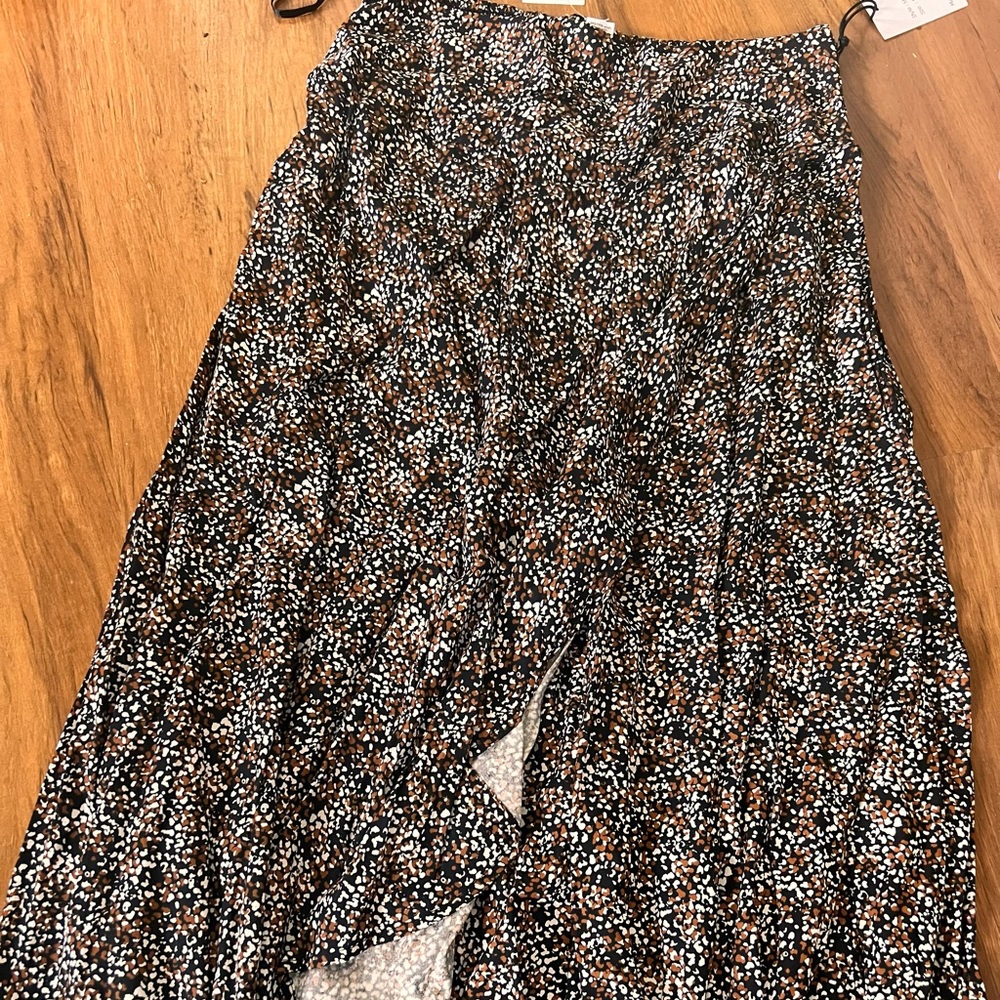 Ankle length skirt with a slit, brand new never worn with tags.